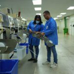 Fenix workers operating industrial machinery