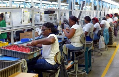 Workers assembling electromechanical components in Fénix's production area