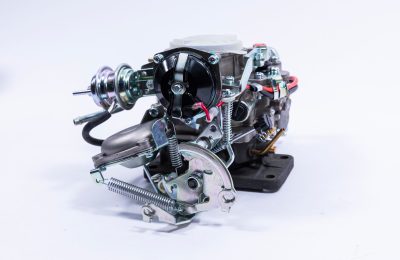 Carburetor with throttle valve open, controlling fuel and air flow