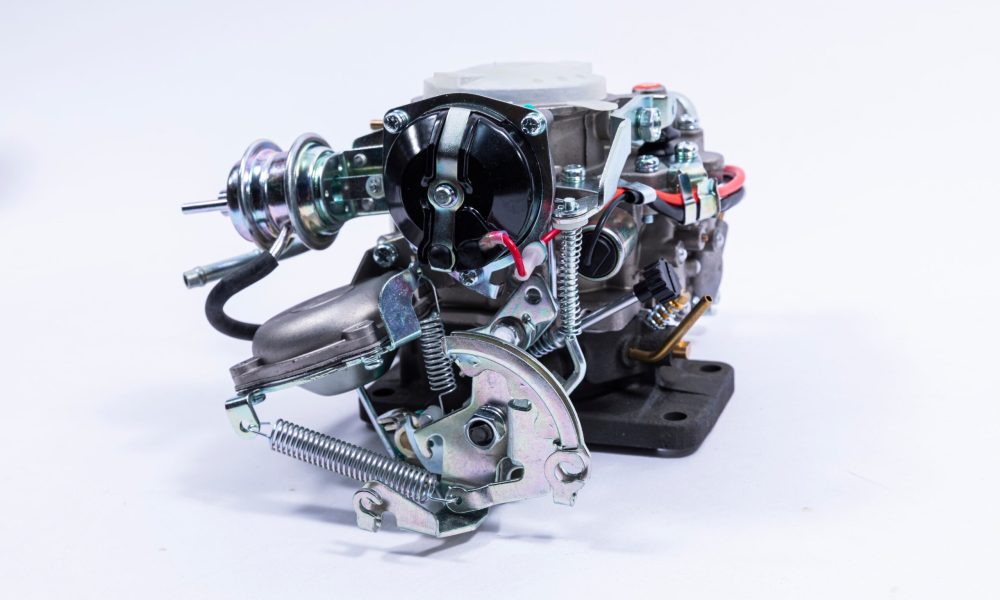 Carburetor with throttle valve open, controlling fuel and air flow