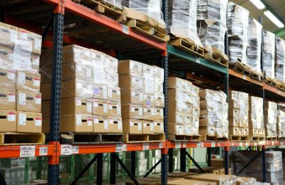 Interior of Fénix's warehouse with shelves and organized boxes