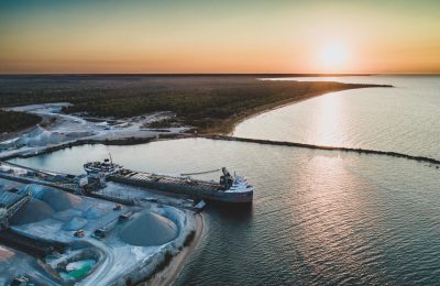 A cargo ship at a Dominican Republic port, highlighting the country's growing role in global trade.